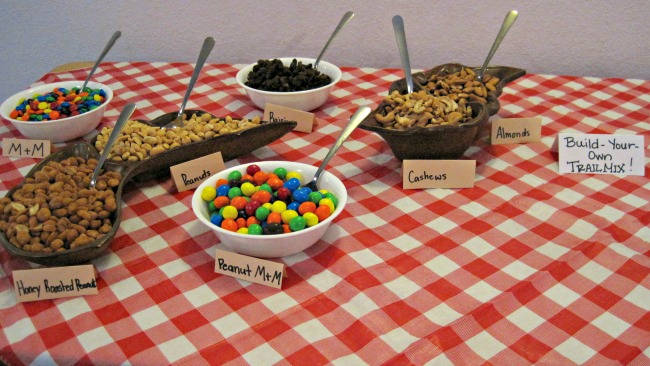 A Build-Your-Own Trailmix station is a great addition to a camping themed party! | A Retro Camper Themed Anniversary Party Build your own trailmix station | camper themed party camping